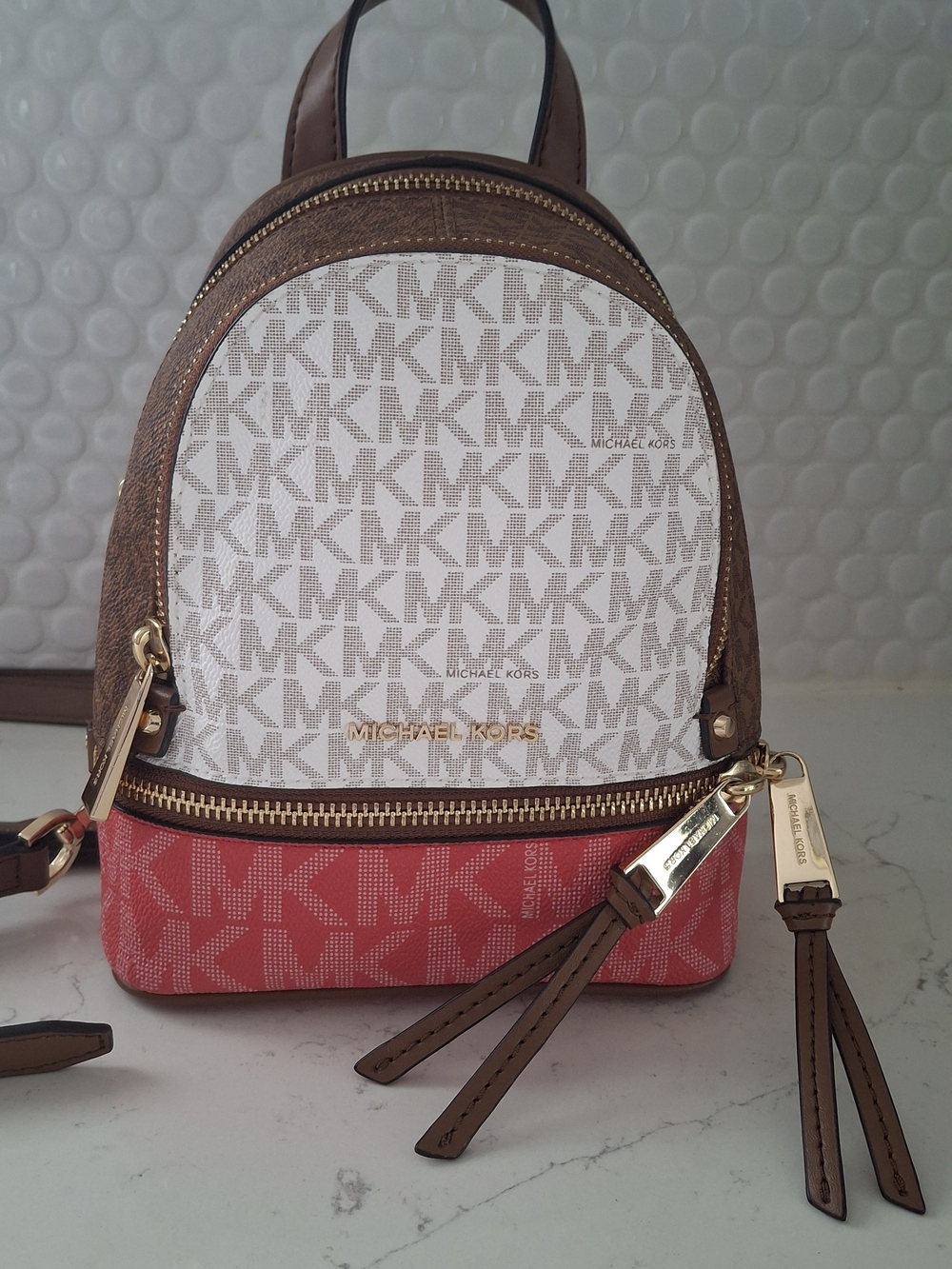 Michael Kors Rhea Mini Convertible Backpack Crossbody Vanilla Pink-Coral Brown